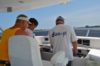 03 Bruce, Kathy, and Bradley navigate out of the&nbsp;marina