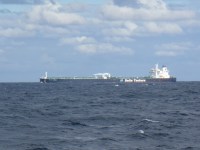 The large ship Delta Poseiden passes our stern