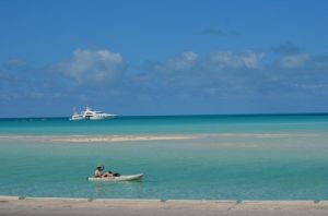 Kayaking with megayacht Wheels in the background (Photo by Darren L.)