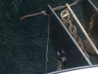 Anchor roller – bolt on left side is loose, weight of chain supported by temporary&nbsp;crowbar)