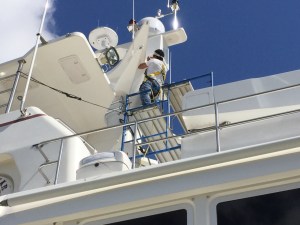 Sergio on the scaffolding working on caulking