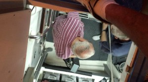 Buddy and Clayton prepare an old battery for removal 