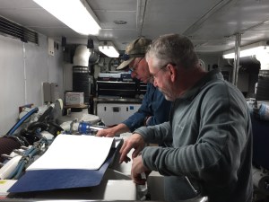 Bradley and Clayton review electrical drawings