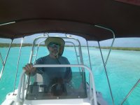 Bradley drives the tender through the beautiful blue water of Bennett’s&nbsp;Creek