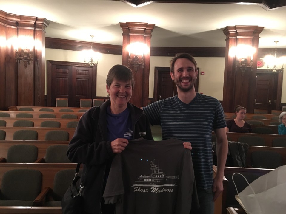 Presenting a Shear Madness T-shirt to Jesse, director of the Charleston Shear Madness