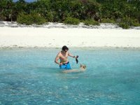 Austin feeds a swimming&nbsp;pig