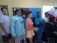 Austin, Bradley, and Toni wait for food at the&nbsp;fair